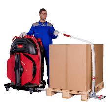 Worker standing upright operating ErgoPack machine